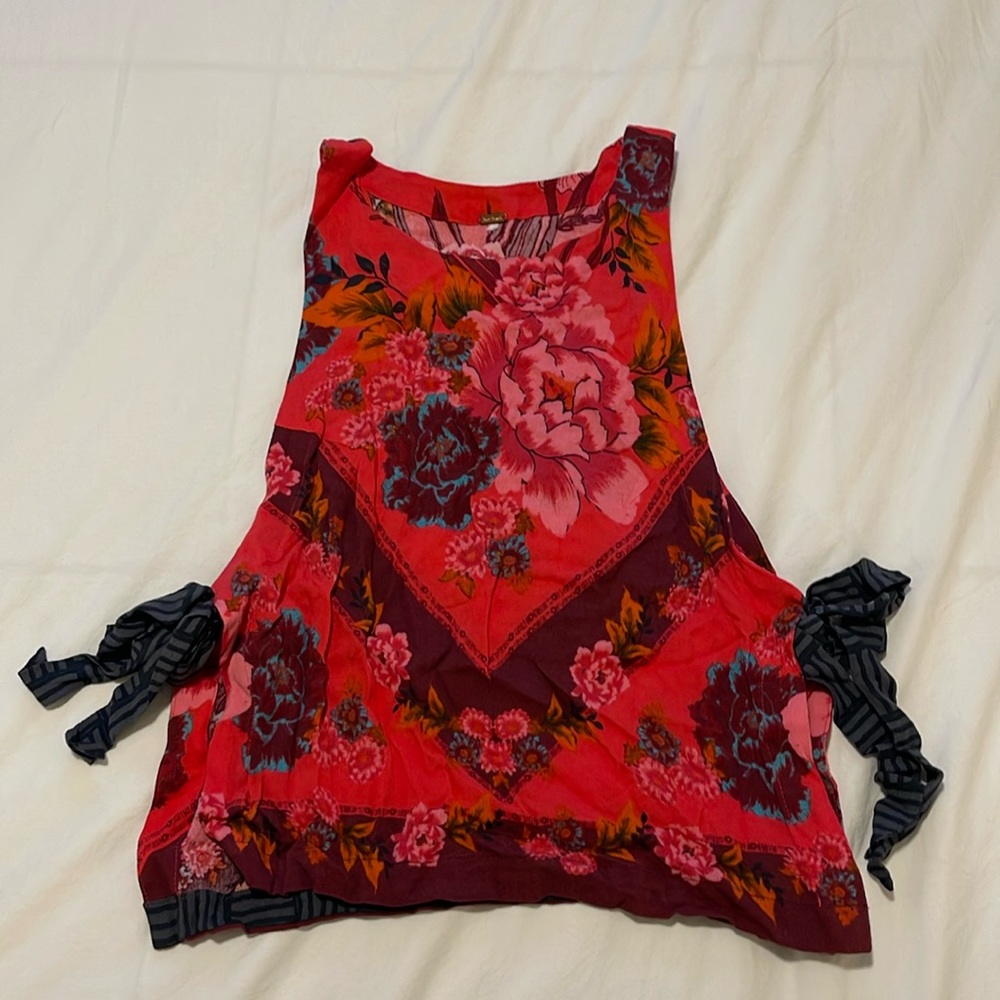 Free People - Tank top. Sides are open/tied together. Deep Pink/Red base color.